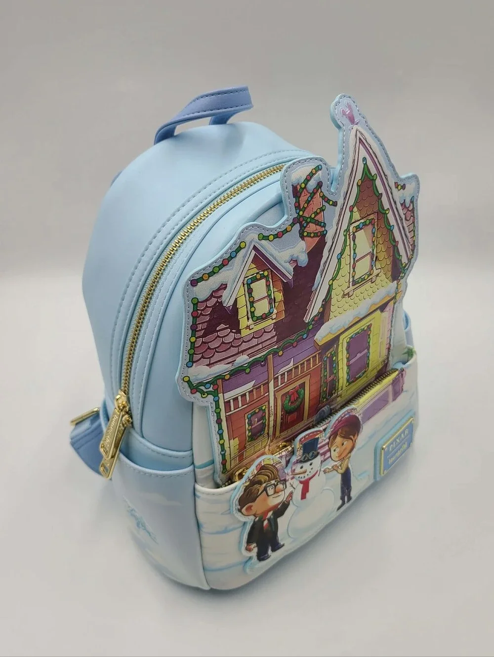 Embark on a magical winter journey with the Loungefly Pixar Up House Christmas
